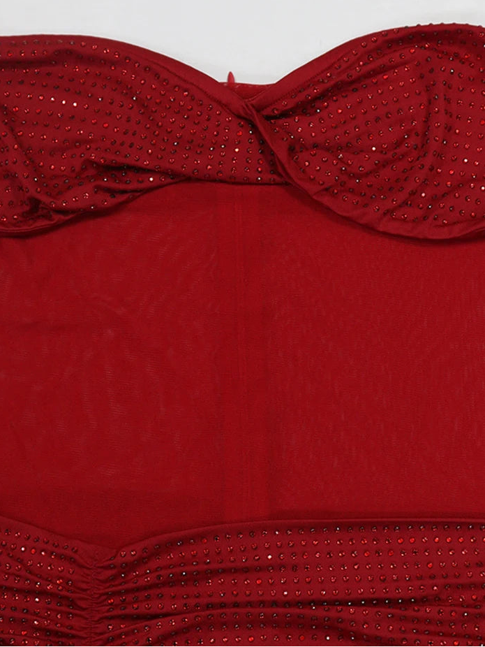 Red strapless top with a bow detail on a white background