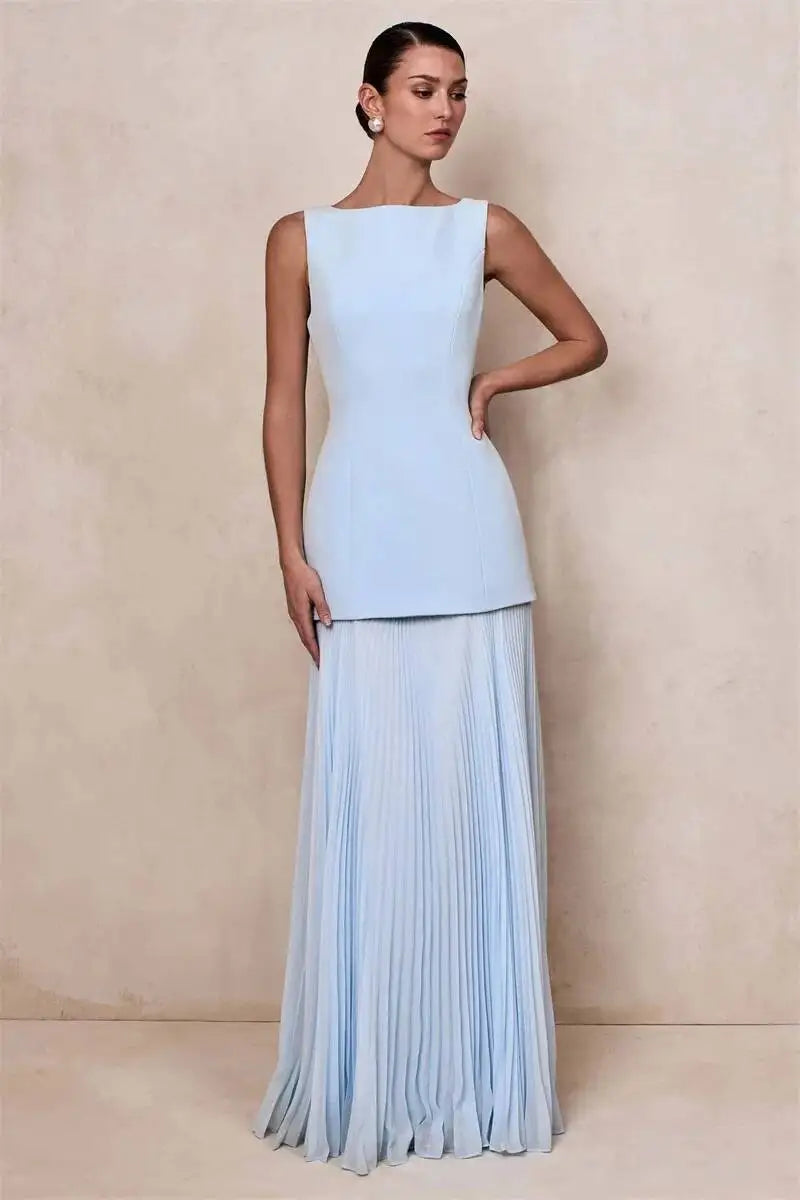 Boat neck sleeveless dress with a floor-length pleated skirt in light blue.