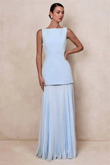 Boat neck sleeveless dress with a floor-length pleated skirt in light blue.