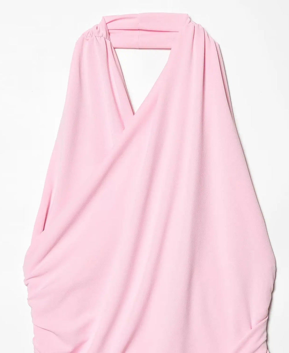 Pink scarf draped over a white background