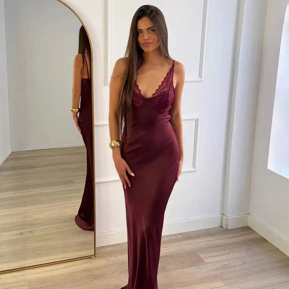 Satin maxi slipdress with V-neck lace trim and spaghetti straps in wine red.