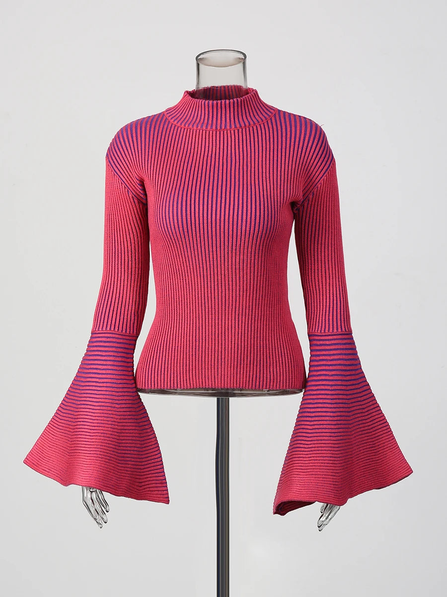Mannequin wearing a pink ribbed top with flared sleeves on a white background