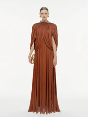 Woman wearing a brown evening gown on a white background