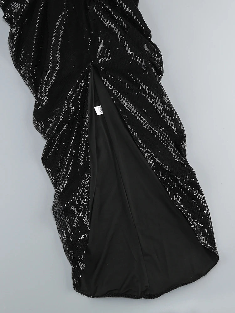 Black sequin dress on a white background
