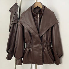 Brown faux leather jacket with cinched waist and high neck detail.