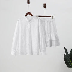White shirt and shorts set on hangers
