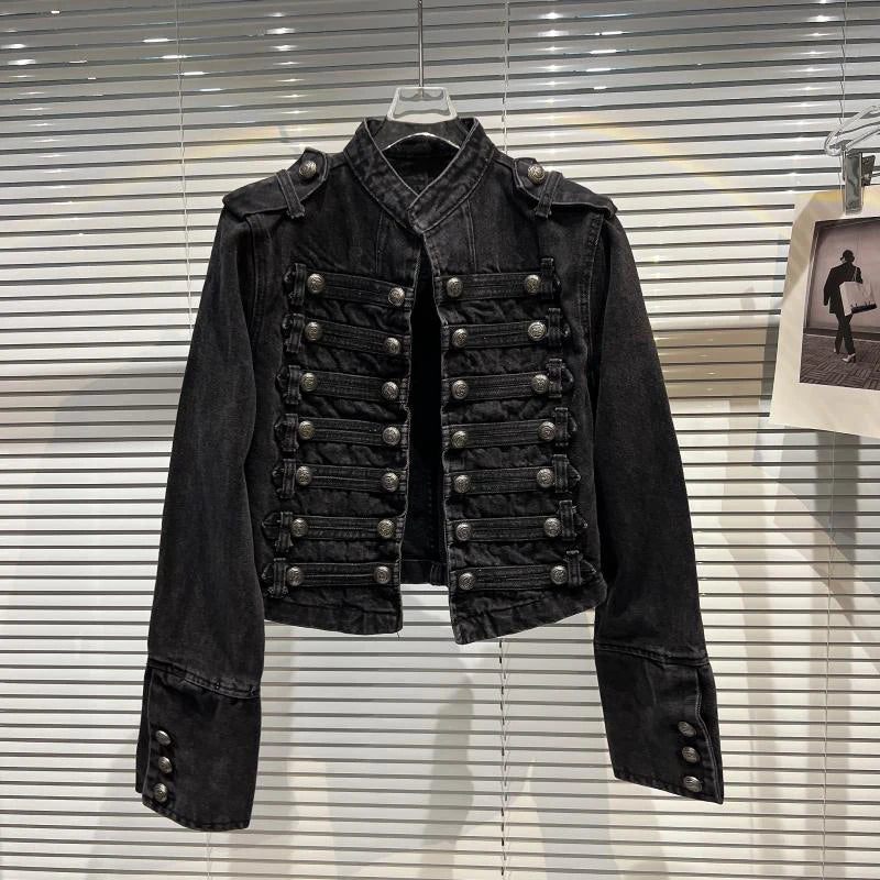 Front view of a black denim jacket with a stand-up collar and double-breasted button closure.