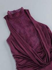 Maroon sleeveless dress with lace detailing on a light gray background