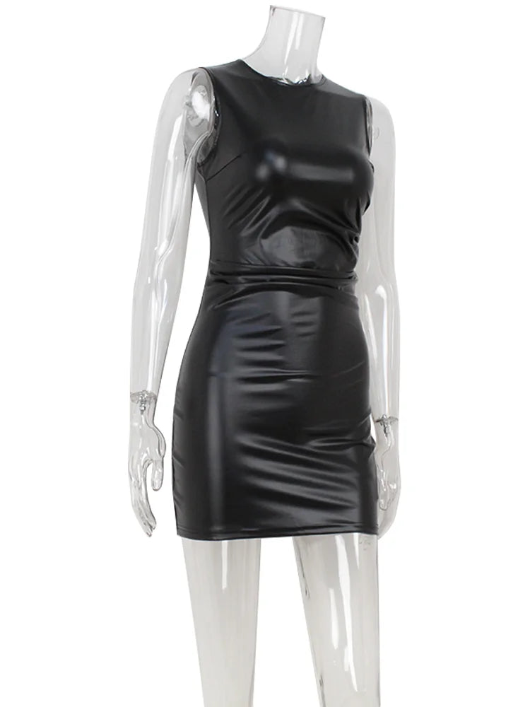 Black leather dress on a mannequin against a white background