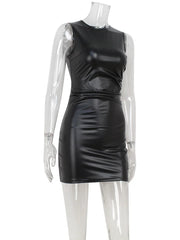 Black leather dress on a mannequin against a white background