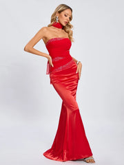 Red satin strapless gown styled for elegant evening events