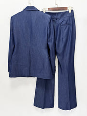 Back view of notched lapel single button blazer and flare leg trousers displayed on hangers