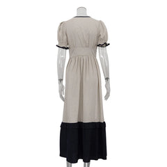 Mannequin wearing a beige dress with black trim on a white background