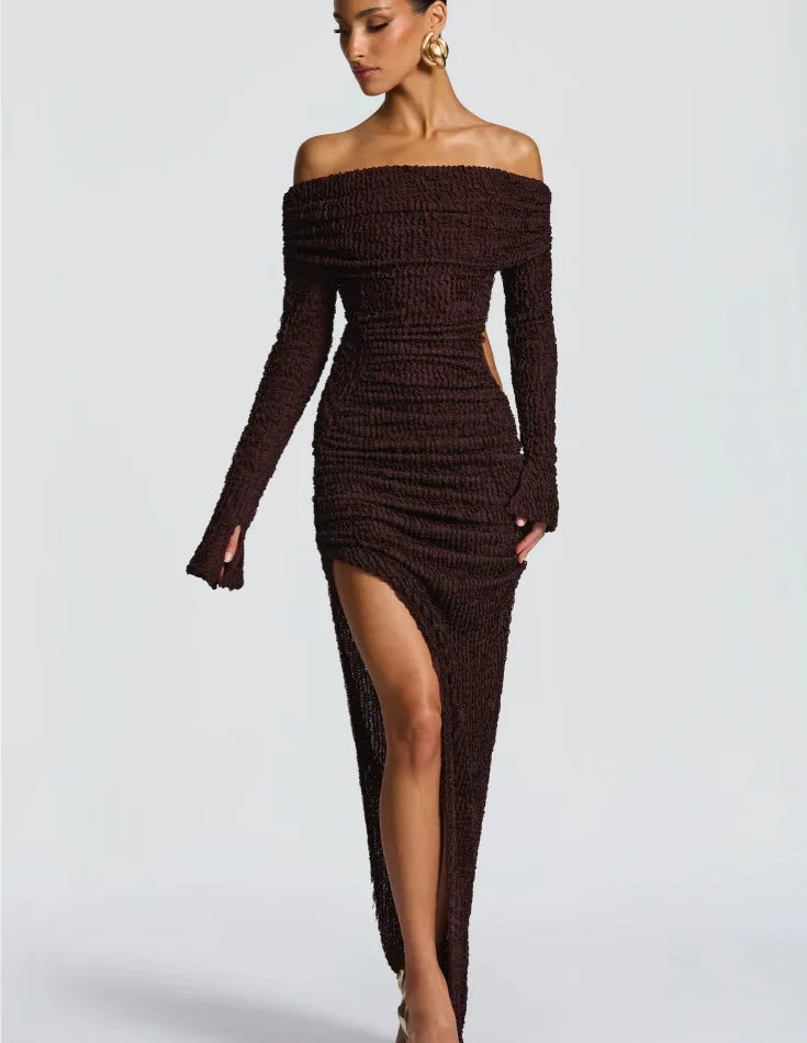 Brown off-shoulder dress with a high slit on a gray background