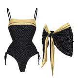 Black polka dot square neck swimsuit with yellow trim and tie sides, paired with a matching yellow and black polka dot scarf.