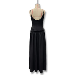 Black dress on a mannequin with a white background