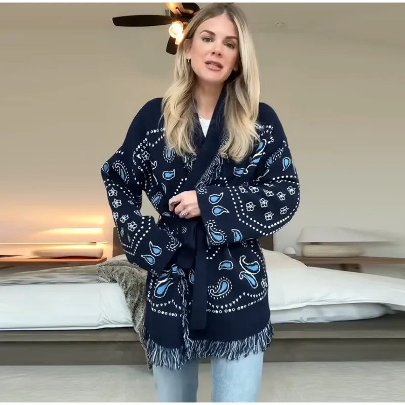 Woman wearing a navy blue patterned scarf in a bedroom setting