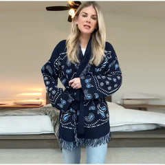 Woman wearing a navy blue patterned scarf in a bedroom setting