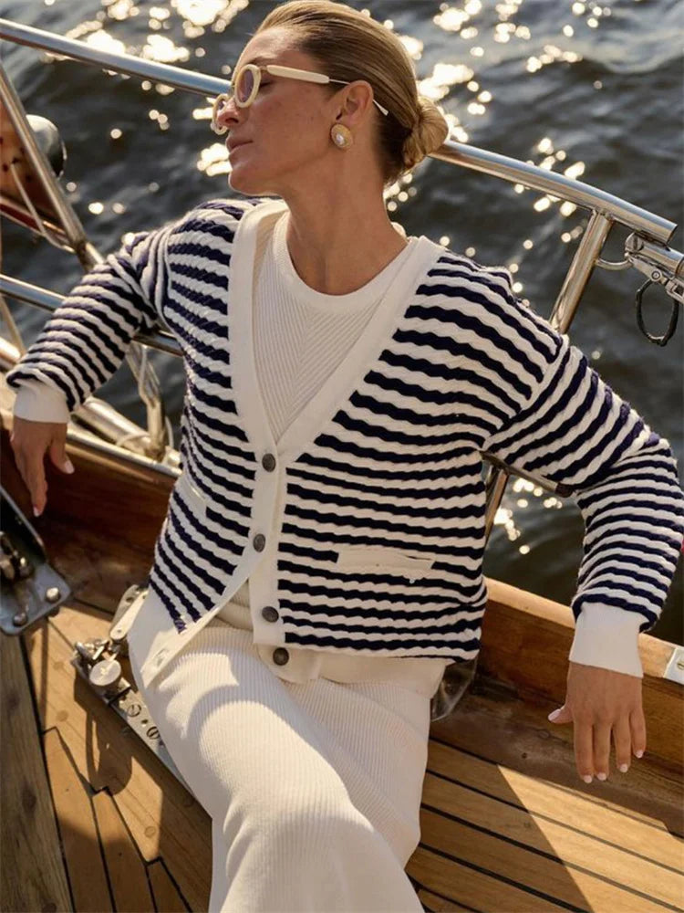 Woman wearing a black and white striped sweater on a boat