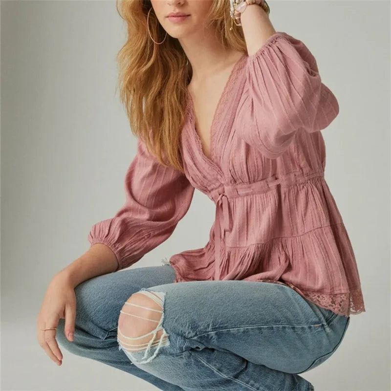 Model wearing pink lace v-neck wrap peplum top