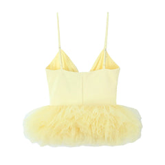 Yellow dress with feathered skirt on a white background