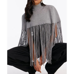 Grey knit poncho with turtleneck and fringe hem