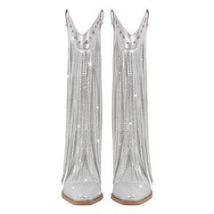 Pair of silver sequin boots on a white background