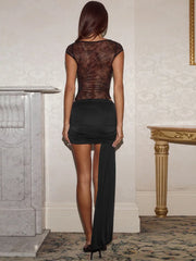 Back view of sheer lace bodysuit and ruched mini skirt set