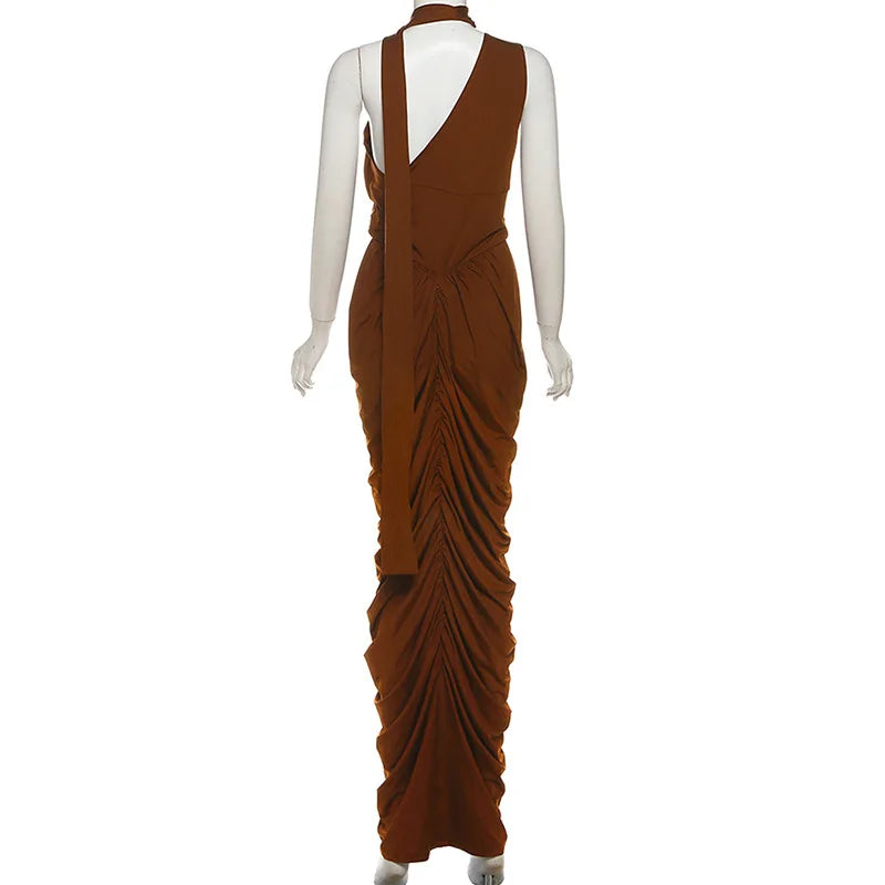 Brown evening gown on a mannequin against a white background