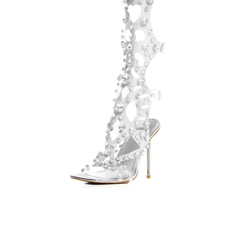 Clear high-heeled shoe with decorative elements