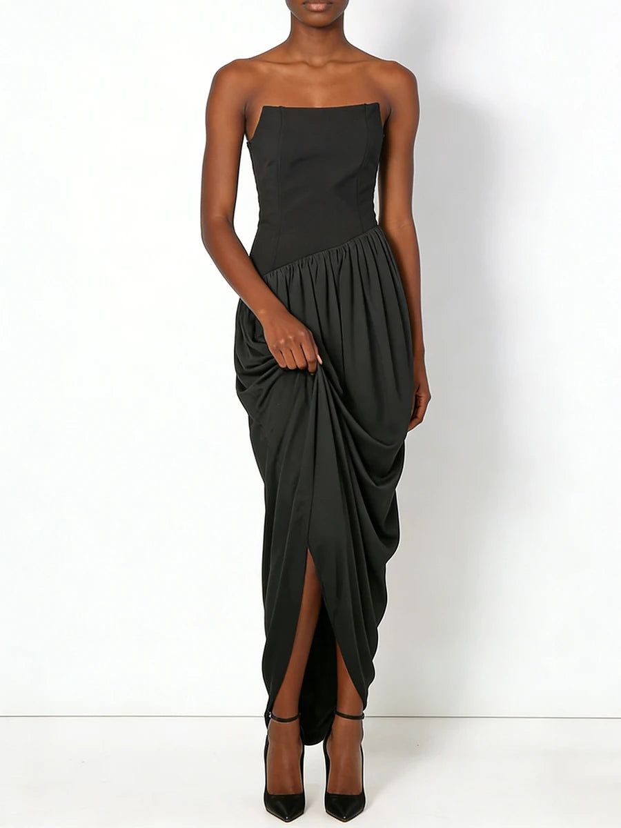 Black strapless dress with draped design on a white background