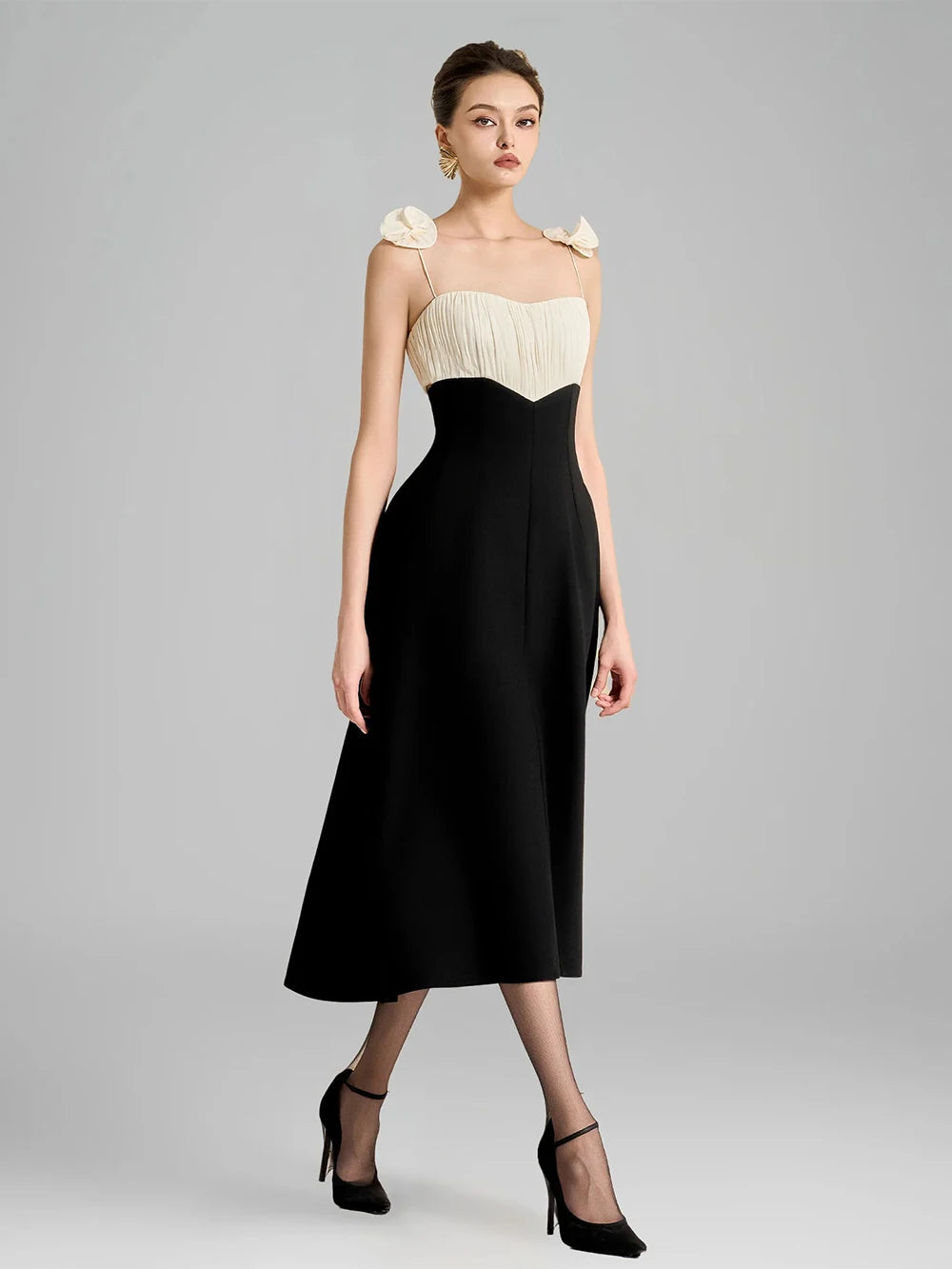 Side view of spaghetti strap ruched bodice midi dress with floral shoulder appliqu�s