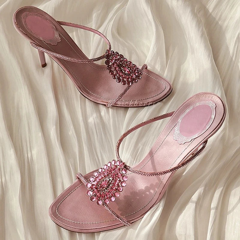 Crystal embellished thin heel sandals with an open toe.