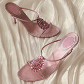 Crystal embellished thin heel sandals with an open toe.