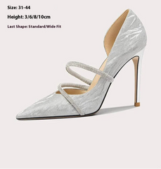 Silver high-heeled shoe with a strappy design on a white background