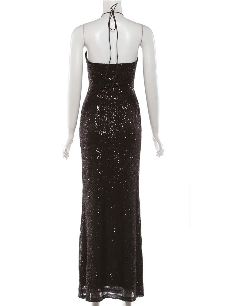 Black sequin evening gown on a mannequin against a white background