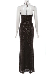 Black sequin evening gown on a mannequin against a white background