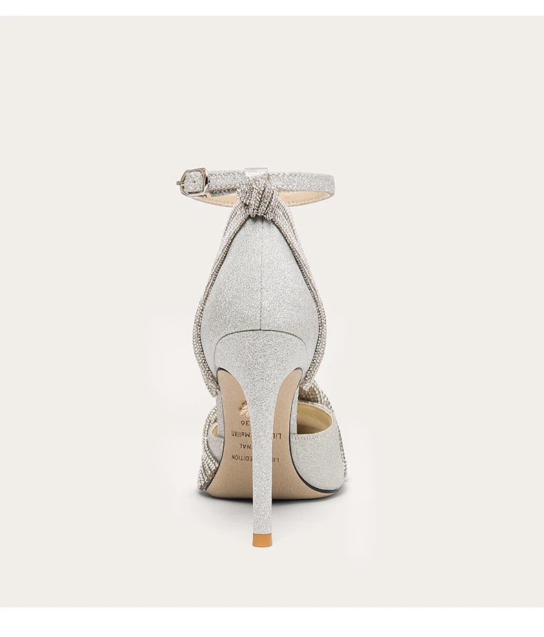 Silver glitter high heel shoe on a white background