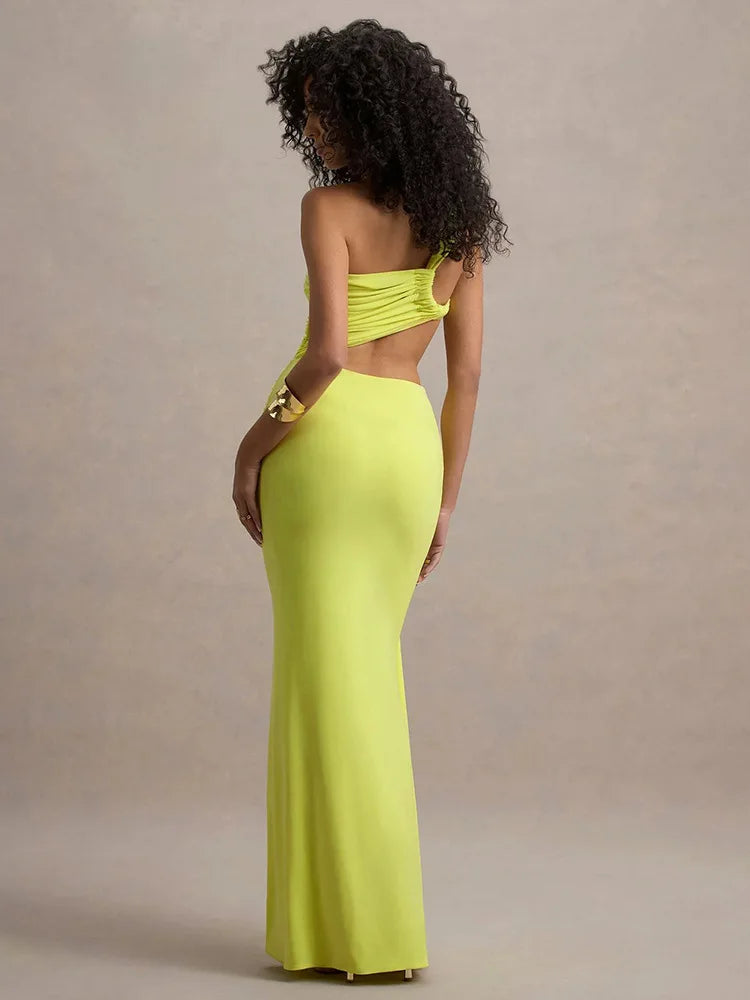 Woman wearing a bright yellow evening gown against a beige background