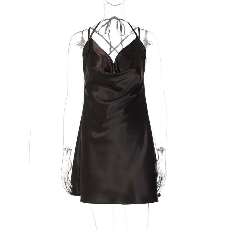 Black satin slip dress on a mannequin against a white background