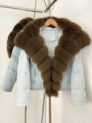 Light blue puffer jacket with brown fur collar on a hanger against a white background