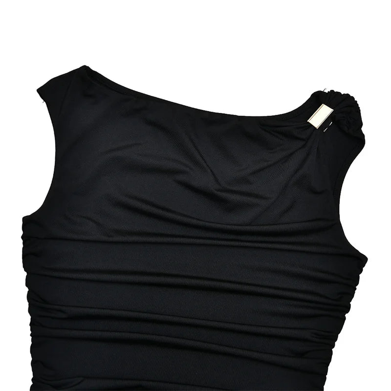 Black sleeveless top with a draped design on a white background
