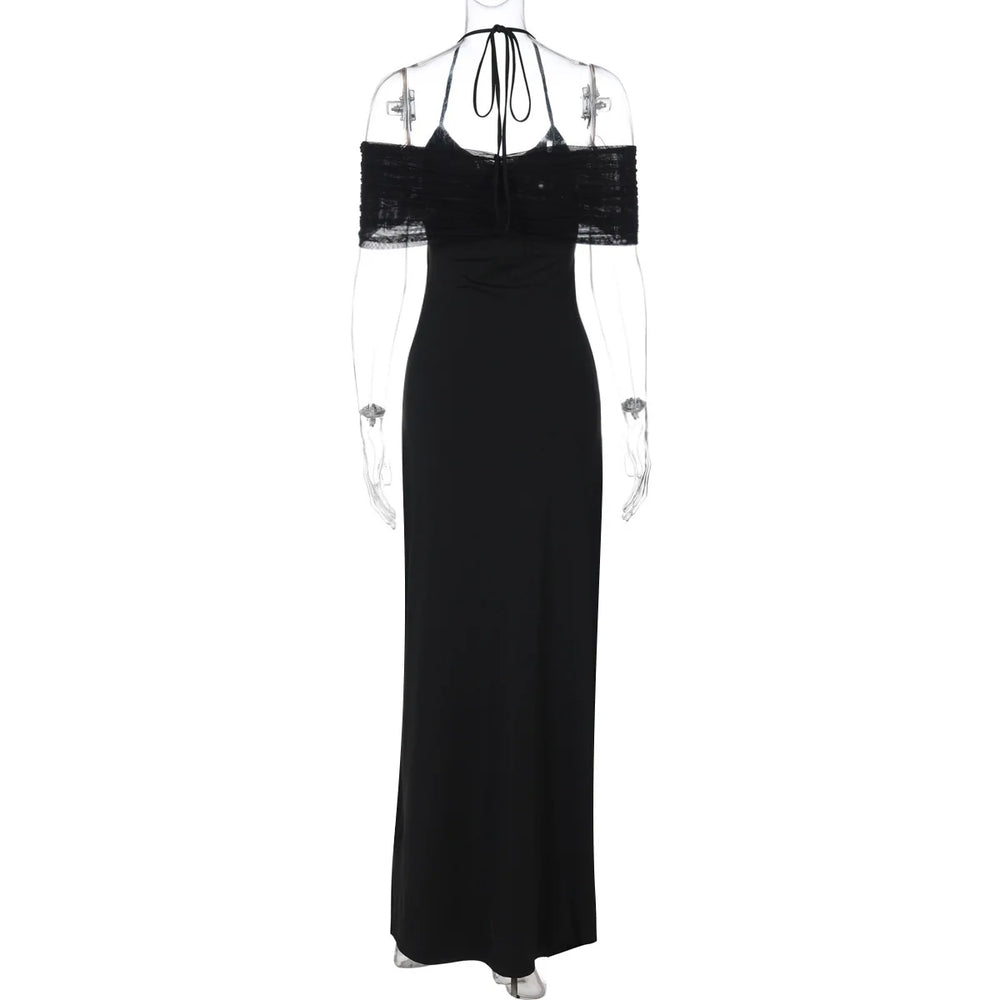 Black evening gown with sheer sleeves on a white background