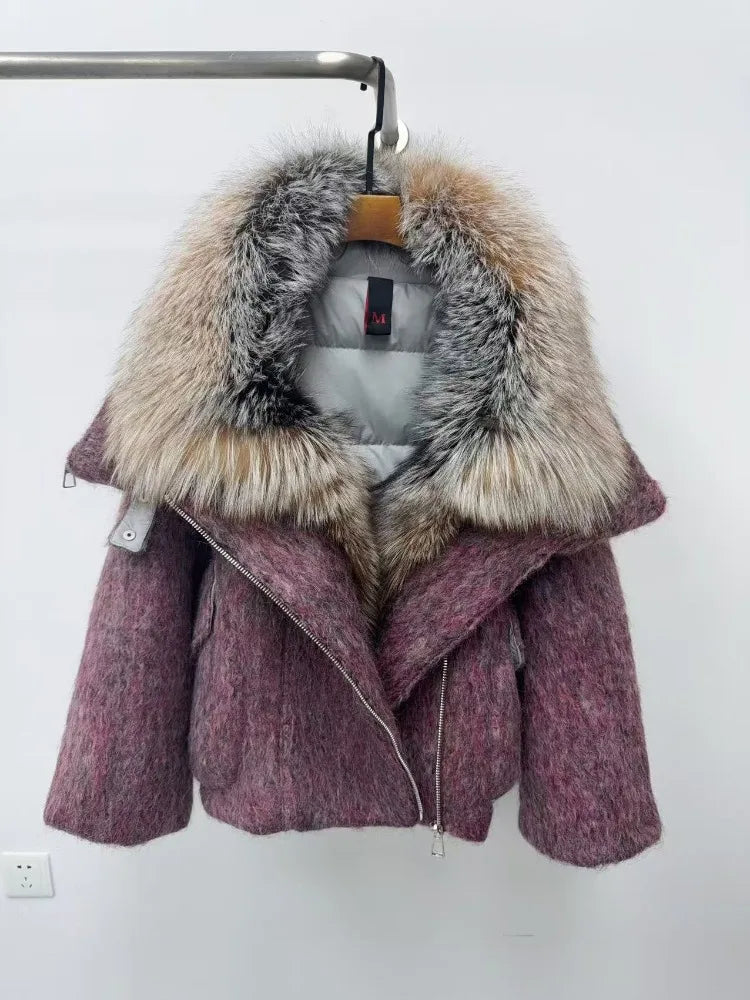 Purple coat with a fur hood on a hanger against a white background