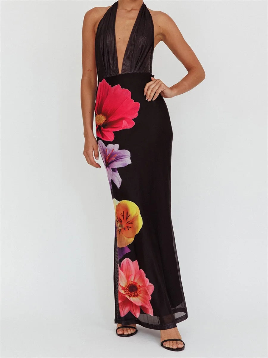 Black halter neck dress with colorful floral patterns on a white background