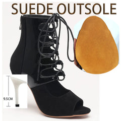 Black suede high-heeled open-toe shoes with lace-up design, suede outsole, and heel height measurement.