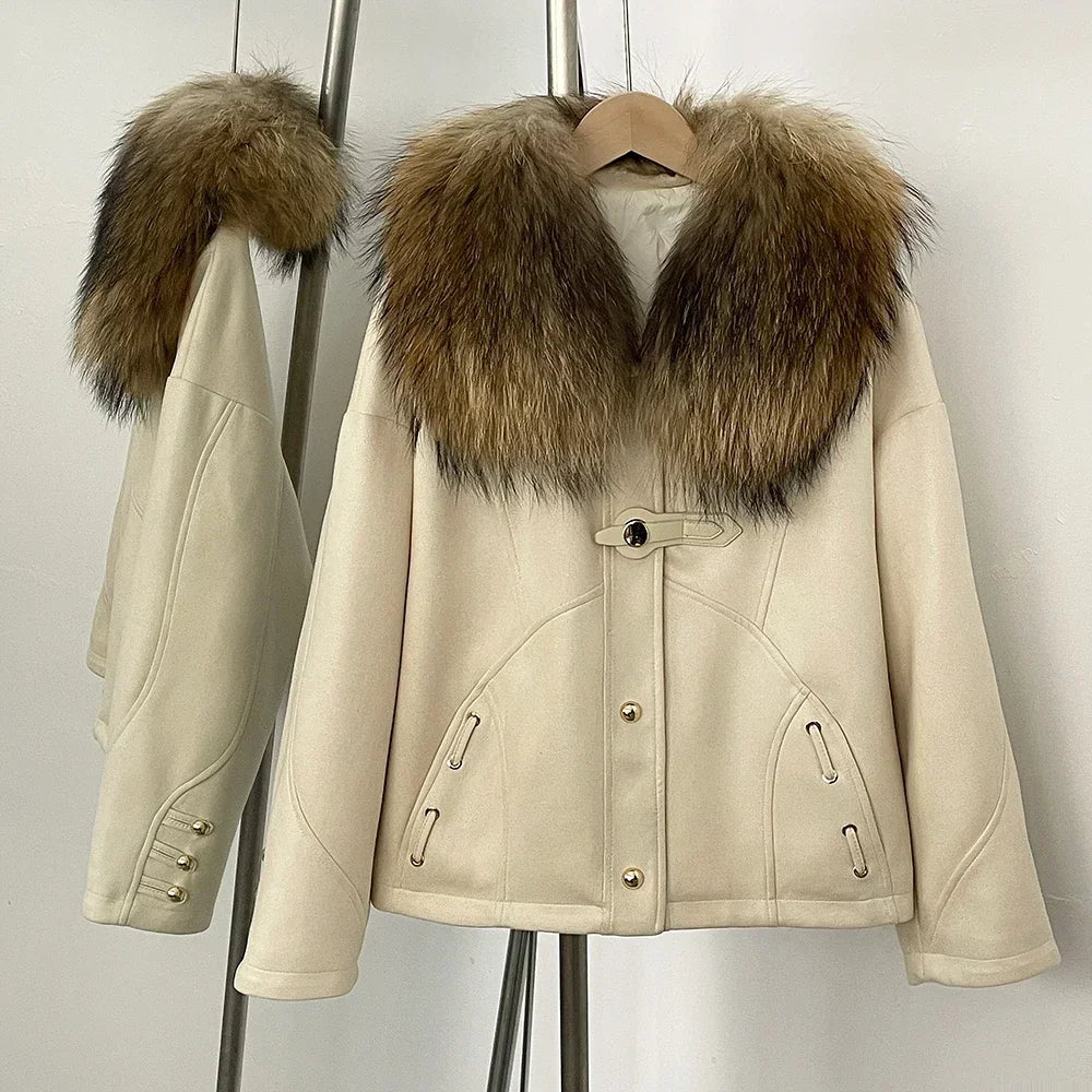 Beige coat with fur collar on a hanger against a plain background