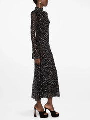 Crystal embellished turtleneck midi dress on a model, side view.