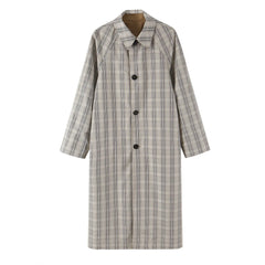 Reversible coat in plaid pattern with lapel collar and button closure.