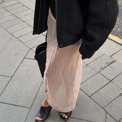 Sheer pleated slit midi skirt on pavement